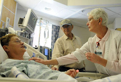 Patent, Caregiver &amp; Nurse In Intensive Care Unit