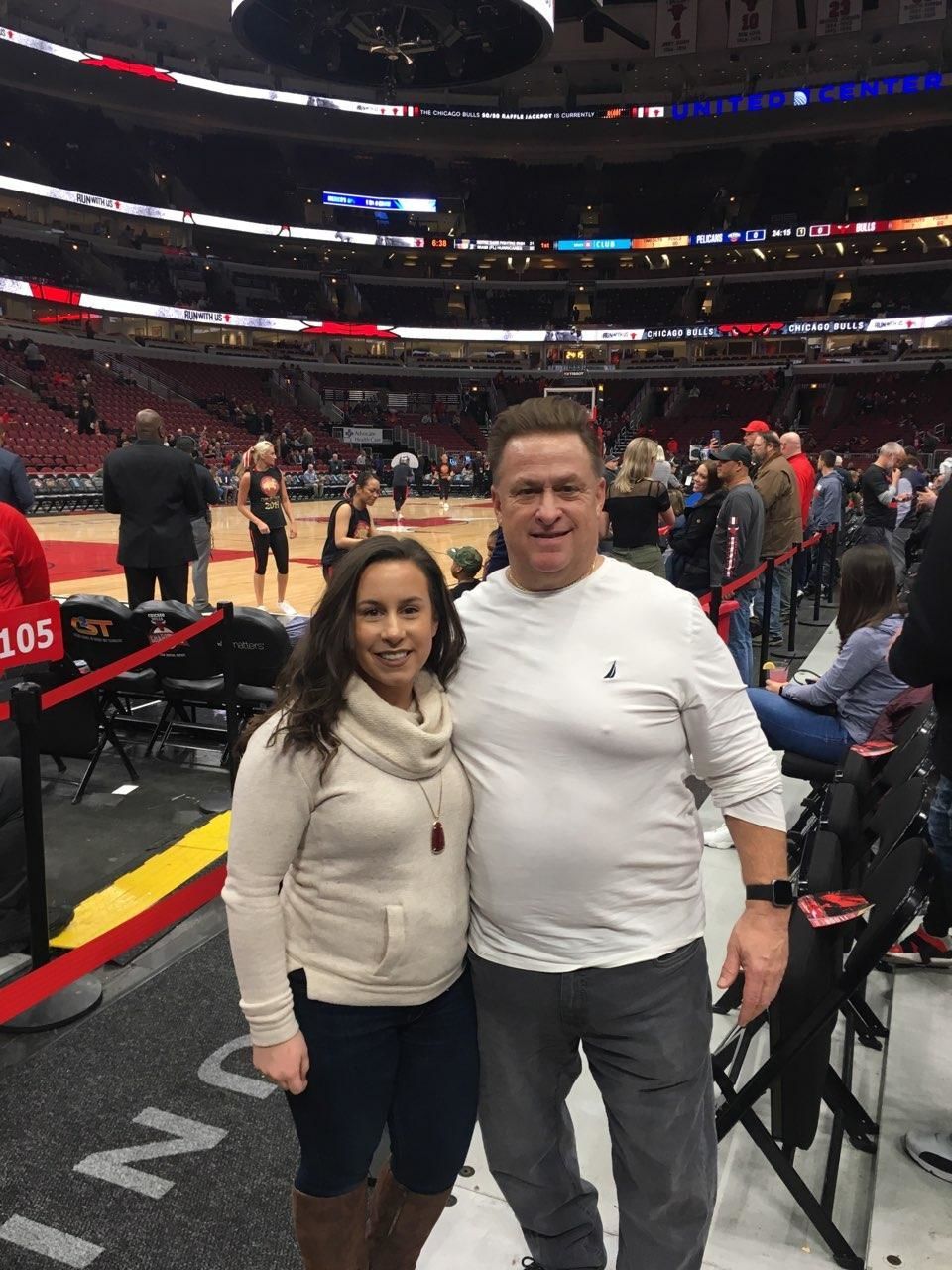 MY REDEMTION - Me and my daughter Alyssa next to our courtside seats at the United Center for a Bulls game.