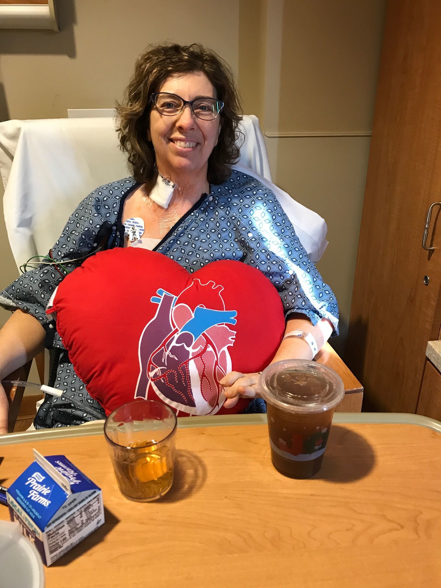2.5 days after surgery. Sitting up, trying to drink a Dunkin Donuts coffee and feeling a little better.