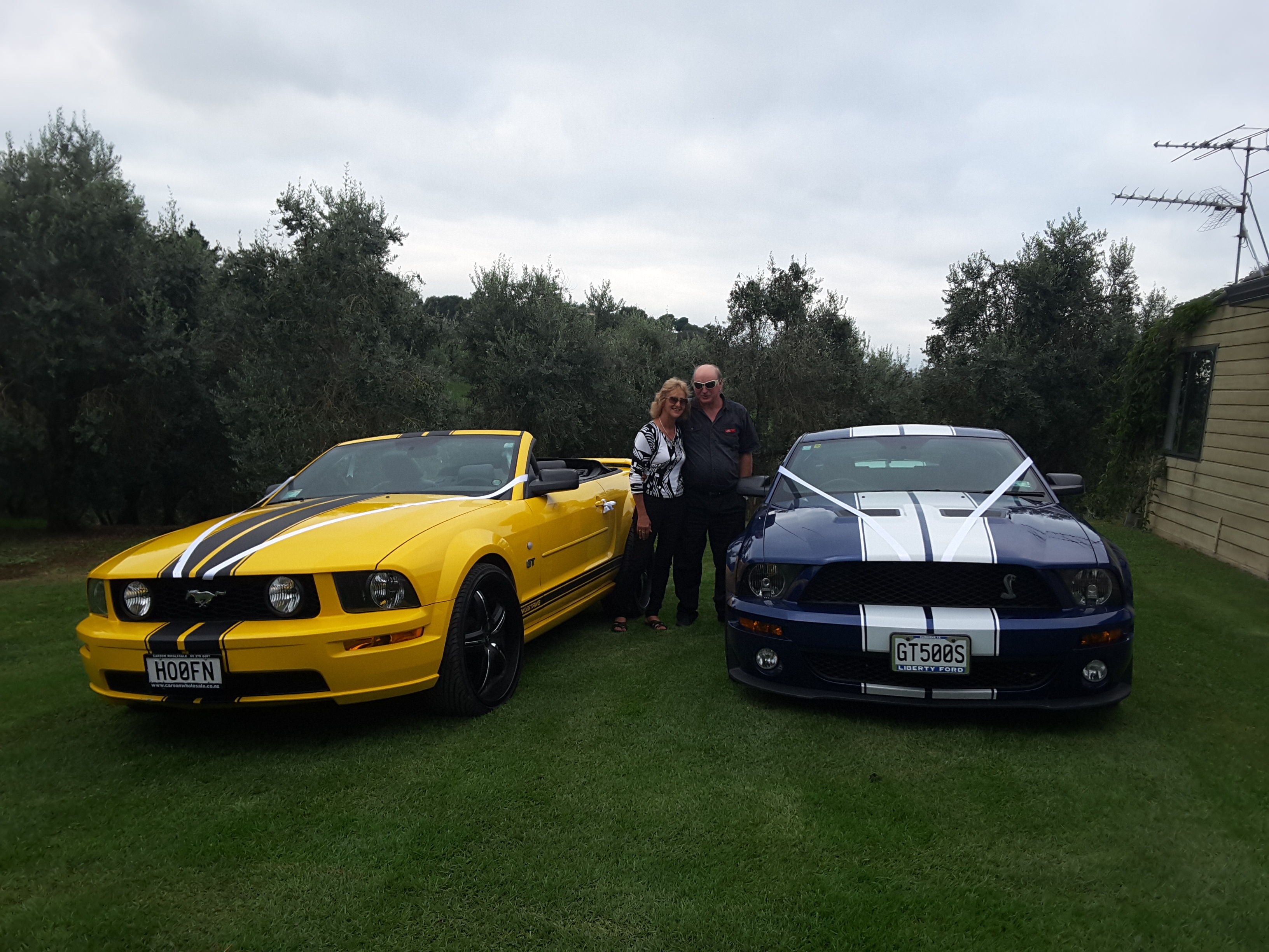 Me and my other half with our mustangs doing a wedding run for friends