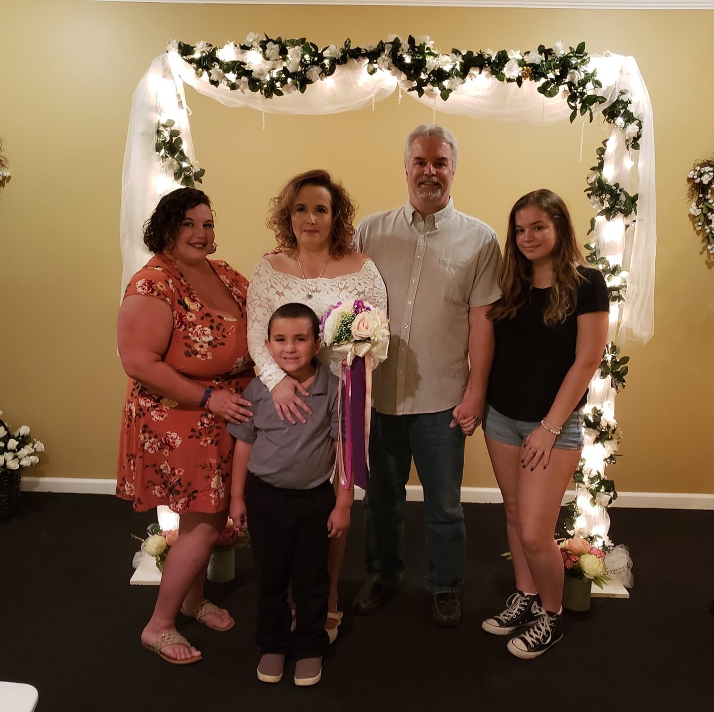 from left to right. My wedding day. My daughter, Ashlee; My grandson; me; Derrick; Darcy, Derrick's youngest daughter