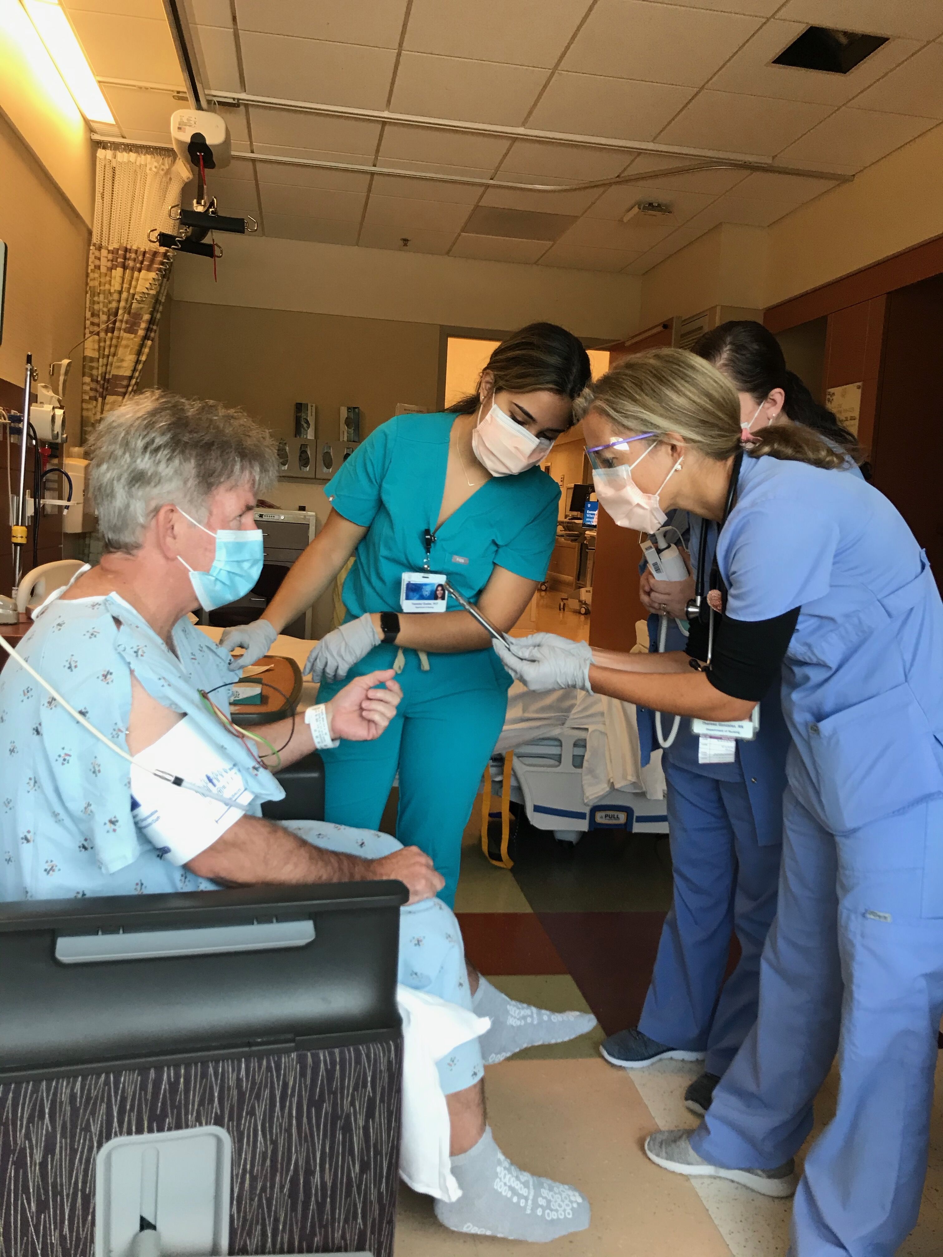 In this photo, I am showing my nurses a 3d color image of my heart from a recent Cat scan. #mayoclinicflorida