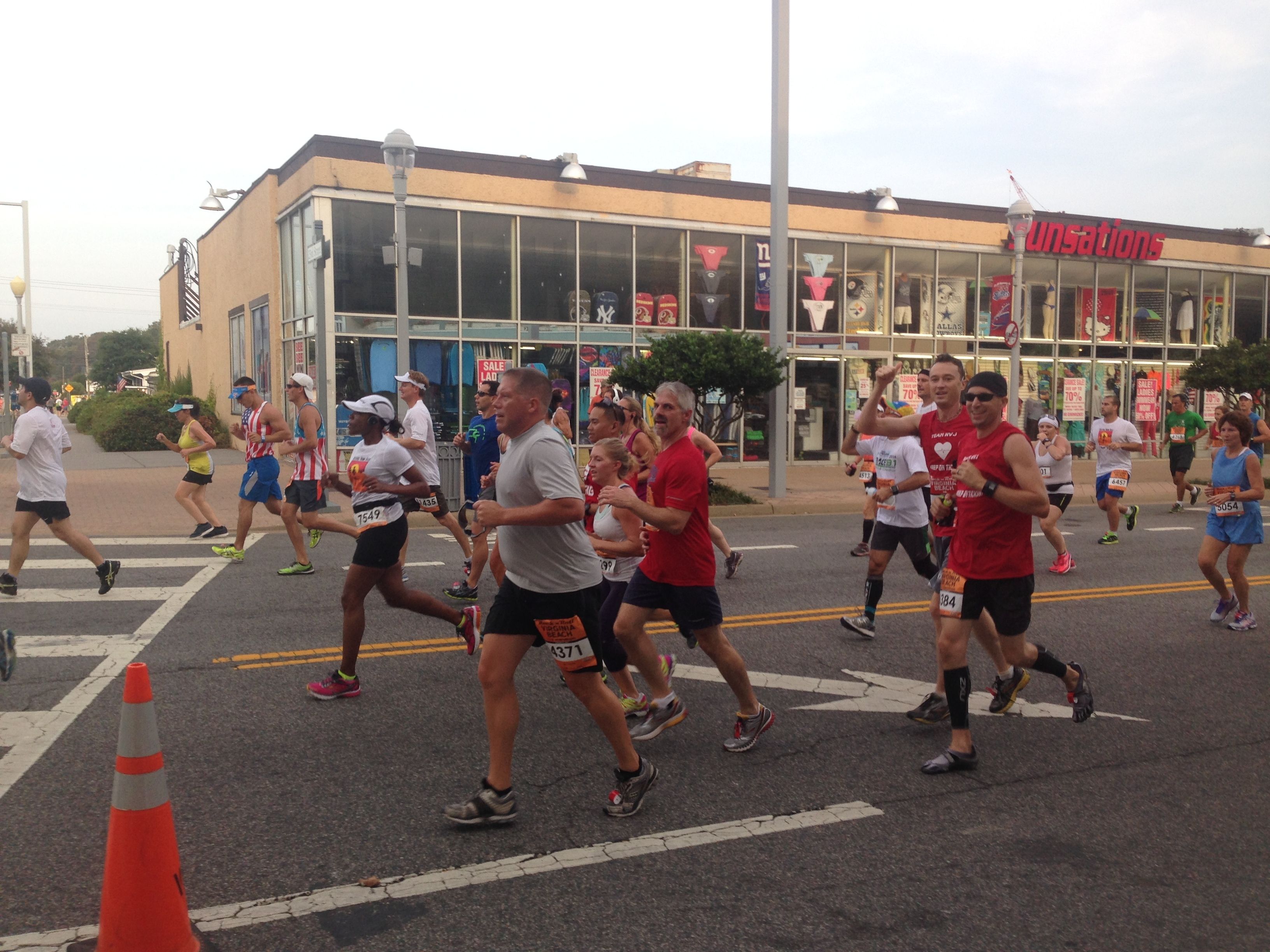 Scott and I passing by around mile 1.5 or so. My parents and kids cheered us all on from the hotel.