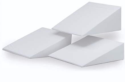 Here's a bed wedge. I don't have a recliner but this has been fabulous. Add your pillows as needed.