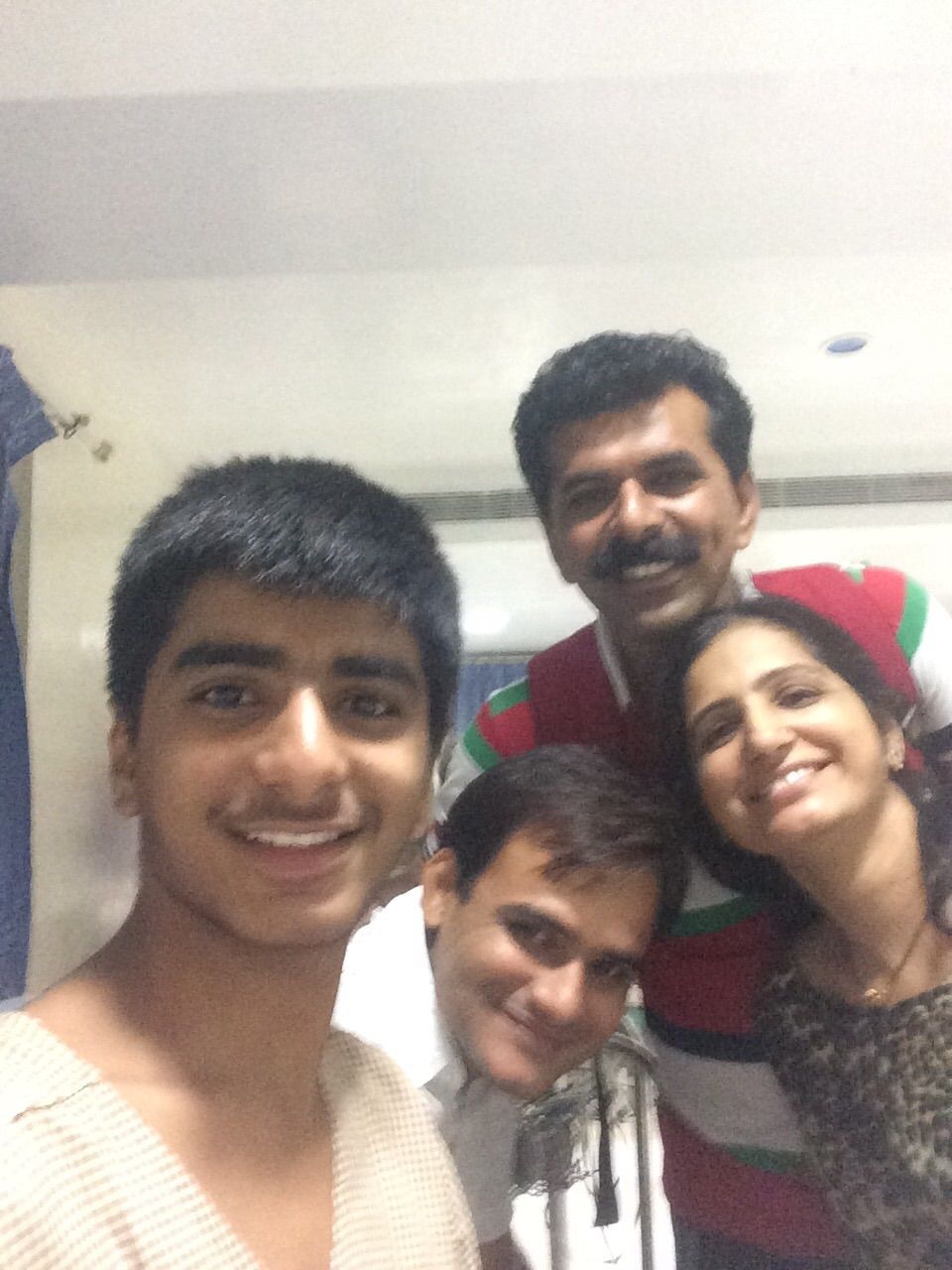 It's grouphy time .....
Hari in front, his dad Ketan in back, his mom Kirtida and uncle Dushyant-that's me in white.

It's exactly 12 hours left for surgery...
