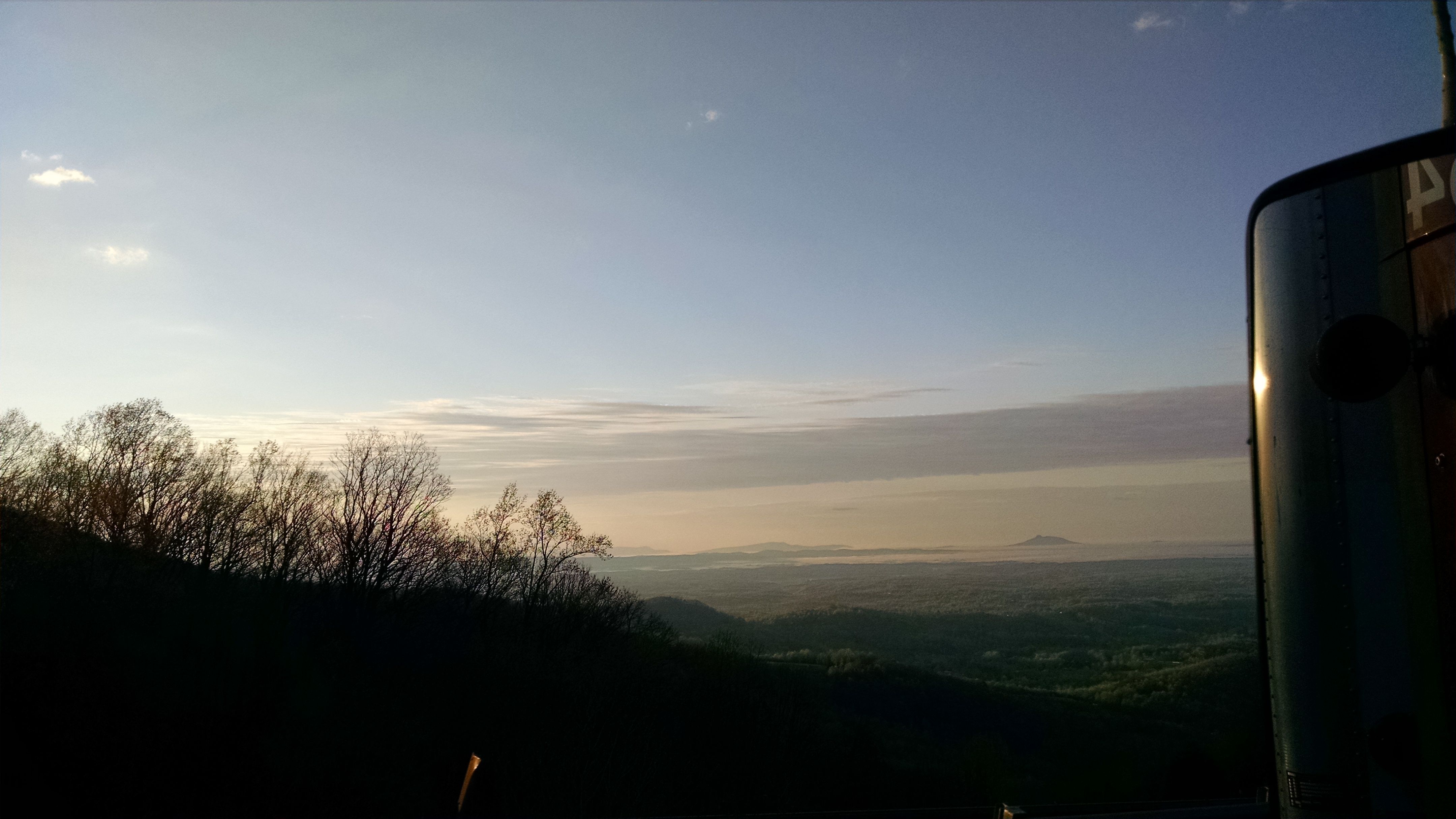 Well, I guess it's time to start thinking about heading back to work. This is a view from my "office" window. Taken at Fancy Gap Virginia, elevation 2800 ft. The little bump right of center and down is Pilot Mountain (Mt. Pilot to all you Mayberry fans) a