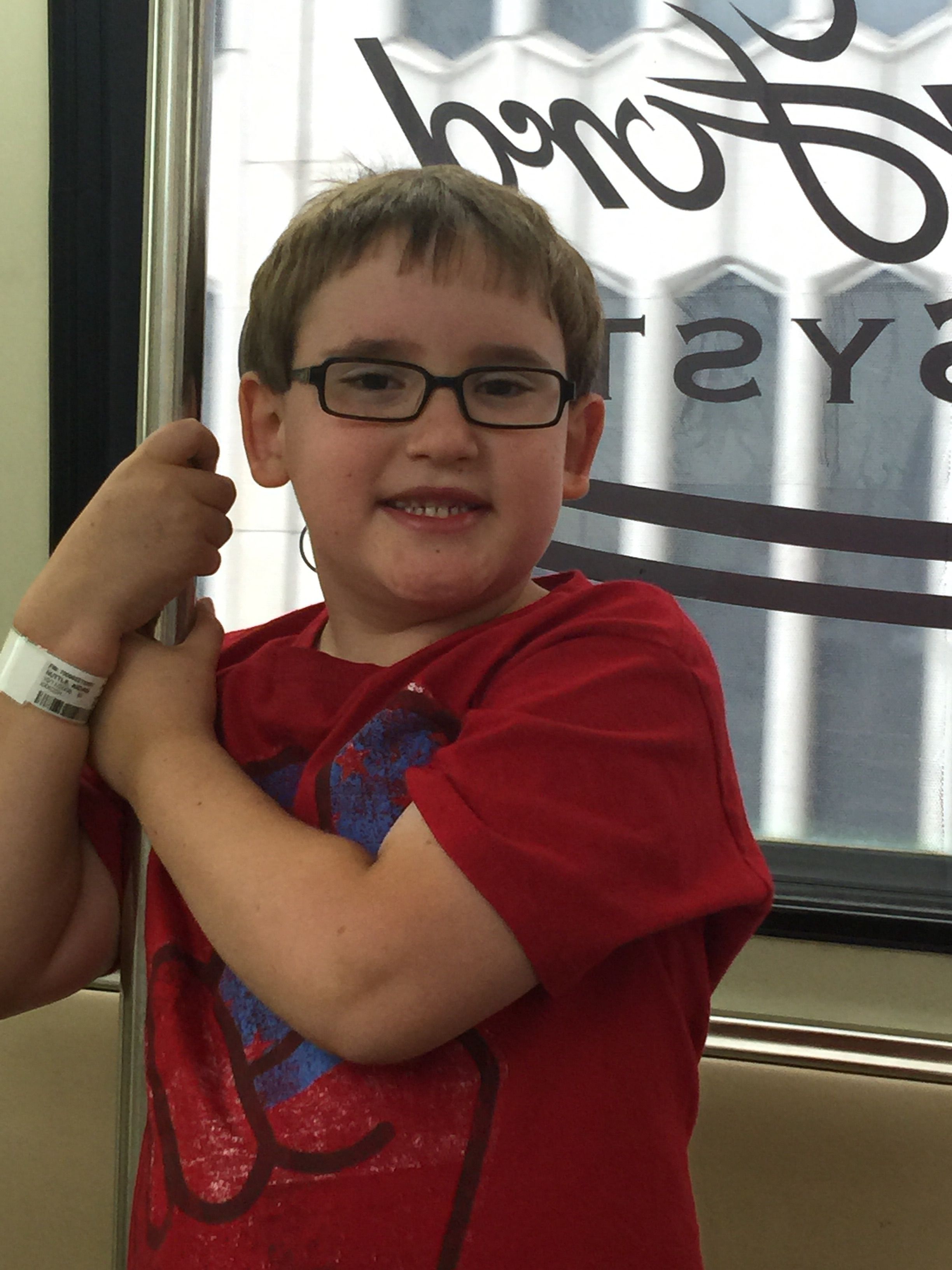 Aidan, riding the People Mover in the D, the night before his surgery.