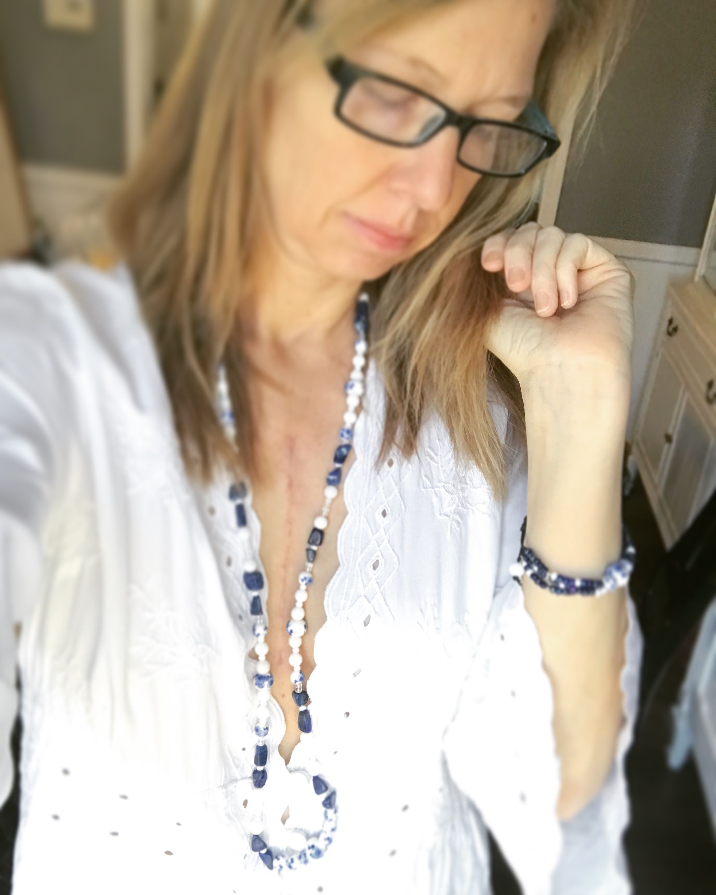 I took this picture to model a bracelet and necklace beads that I made to sell in my Etsy store. And at first I was going to Photoshop out my scarâ€¦ But I'm not going to hide who I am. This is me. :)