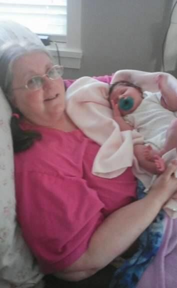 With Granddaughter - 8 days old